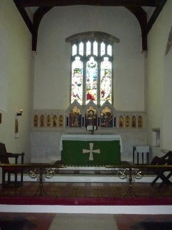 Altar and stained glass windows.