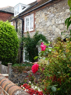 Roses on a stone cottage.